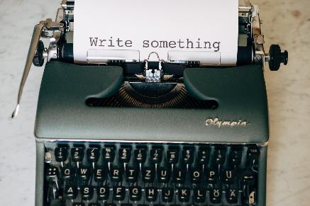Gallery Image 06 black and white typewriter on green table
